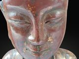 an image of a statue of a person with a crown on his head