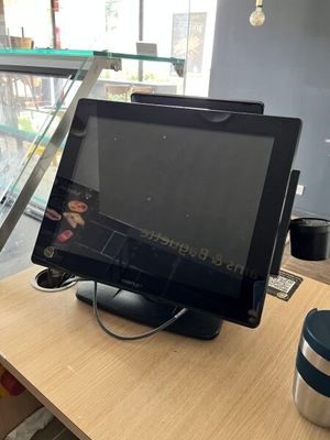 a tablet computer sitting on top of a wooden table