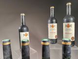 several bottles of wine sitting on top of a clear display case