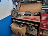 a workbench with a lot of tools on top of it