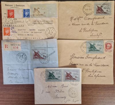 several old envelopes sitting on top of a wooden table next to each other