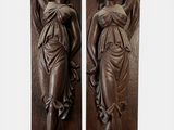 pair of bronze sculptures of a woman and a man