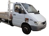 a white truck that is parked on the side of the road