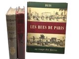 deux livres posés l'un à côté de l'autre sur une surface blanche