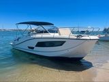 two boats that are parked on the shore of the water