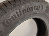 a close up of a tire on a white surface with the word continental written on it