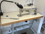 a sewing machine sitting on a table in a room