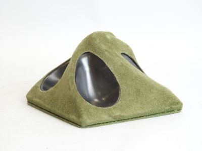 a small triangle shaped object with a hole in it