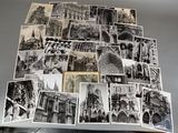 many black and white pictures of buildings on a table