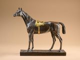 an image of a statue of a horse on a wooden base