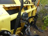 a close up of the front end of a yellow dump truck