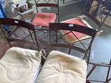 two chairs that are sitting on a rug in a room