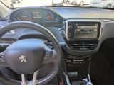 the interior of a small car with a steering wheel and dashboard