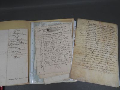 several old papers are sitting on top of a table