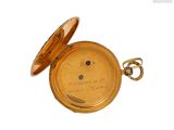 an image of a gold pocket watch with a diamond in the center