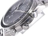 a close up of a watch on a metal bracelet