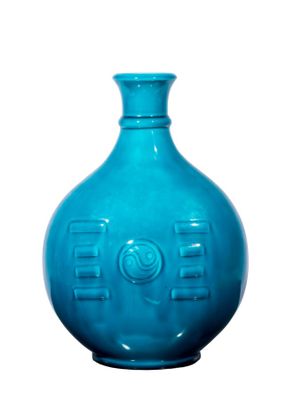 a blue vase that is sitting on a white surface