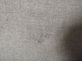 a close up of a piece of fabric with a small hole in it