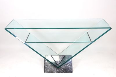 a close up of a glass table with a metal base