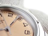 a close up of a watch on a cloth
