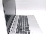 a laptop computer that is sitting on a white surface