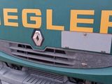 a green and yellow truck parked on the side of the road