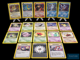a lot of pokemon cards that are on the table