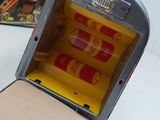 a small tin toy that is sitting on a table