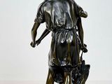 statue of a man and a woman with a dog on a white background