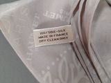a close up of a tie with a label on it