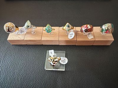 a display of miniature food items on a wooden stand