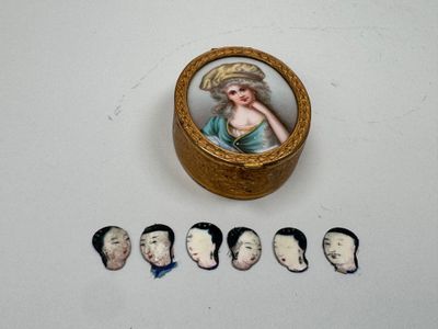 a small box with a picture of a woman on it