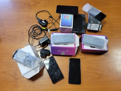 many electronic devices that are on the table together