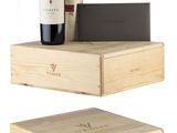 two wooden boxes with a bottle of wine and a bottle of wine on them