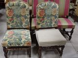 four chairs that are sitting on a tile floor