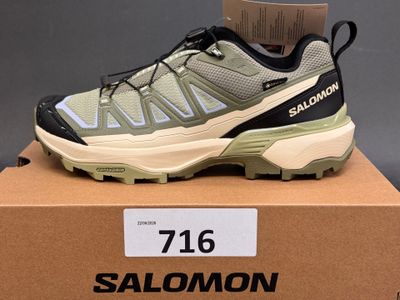 the salomon shoes are in a box on a table