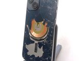 a cell phone with a broken screen on a stand