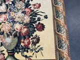 a picture of a picture of a vase of flowers on a table