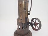 an old fashioned steam engine that is sitting on a table