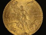an image of a gold coin with an angel on it