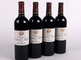 three bottles of red wine are lined up on a white surface