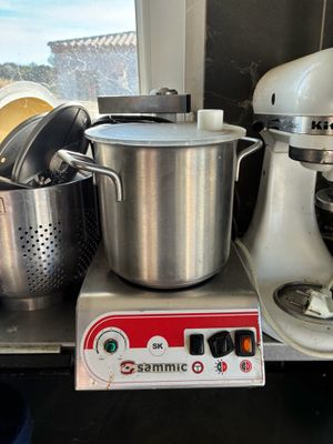 a mixer and a blender sitting on a counter