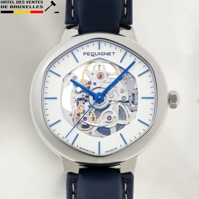 a close up of a wrist watch with a blue second hand