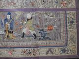 a quilt with a picture of a man and a woman on it