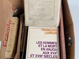 a box full of books that are sitting on a table