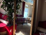 a large mirror in the corner of a room