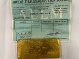 an image of a piece of gold sitting on top of a piece of paper