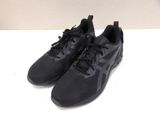 a pair of black running shoes on a white surface