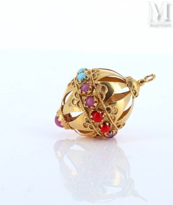 an image of a close up of a gold ring with a red and blue bead