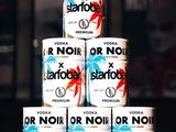 several cans of vodka are stacked on top of each other